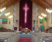 Our sanctuary, decorated for thanksgiving, showcases the beauty of the cross.